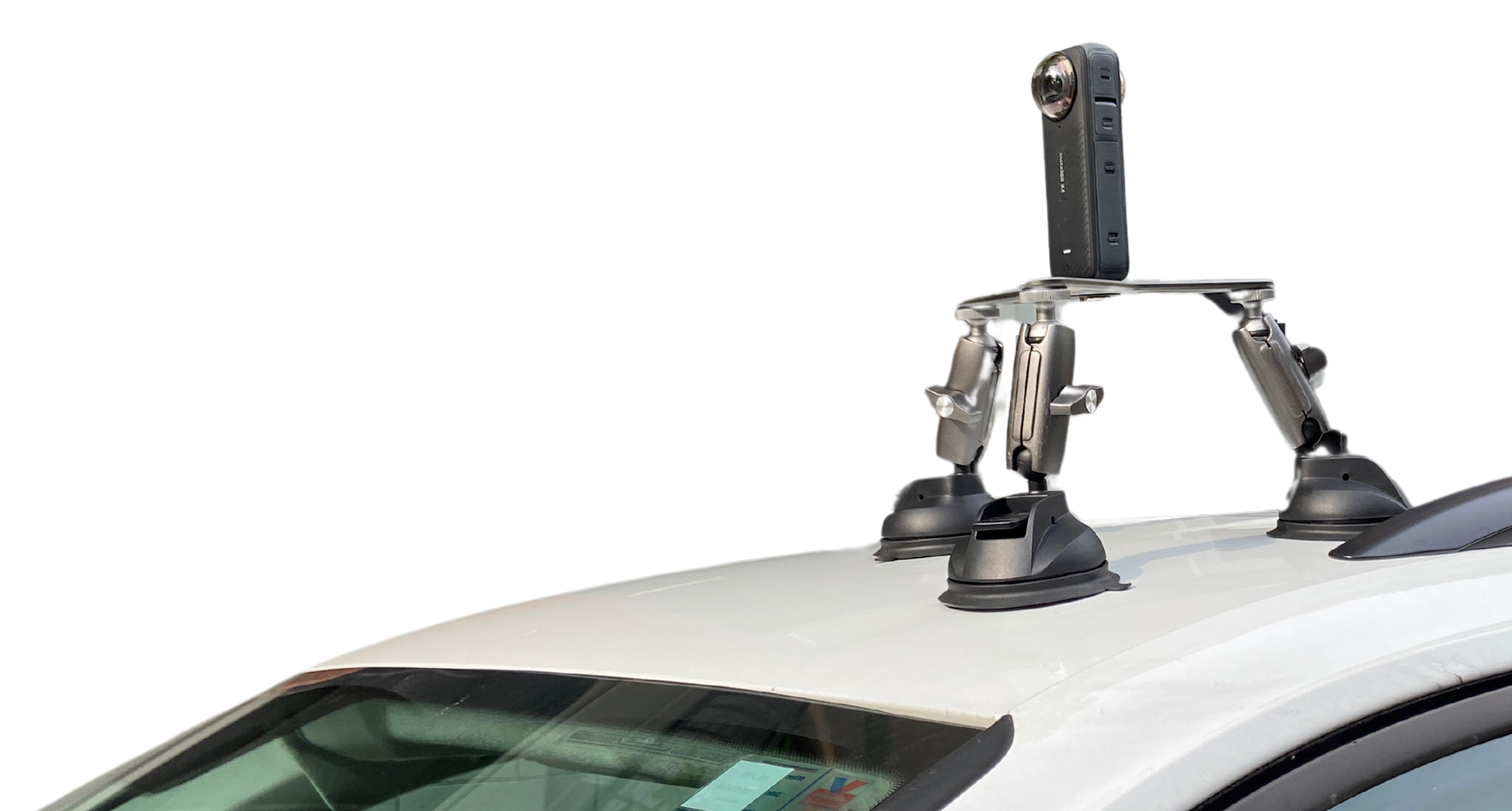 Camera mounted with tripod on top of vehicle